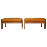 Pair of leather and caviuna wood ottomans