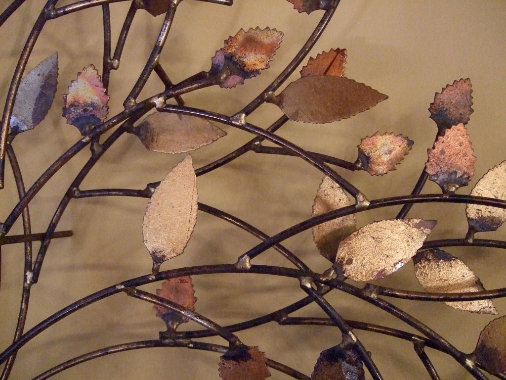 Wall sculpture tree with oxidized brass leaves signed Bowie.  Tree hangs away from the wall and has fantastic detail and dimension