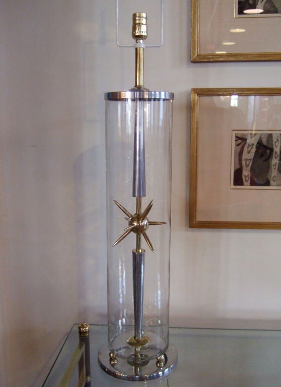 Glass cylindrical table lamp with inserted brass sputnik.  Newly polished and rewired.  Shade not included.