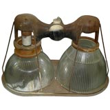 A CLASSIC INDUSTRIAL DOUBLE LIGHT HOLOPHANE FIXTURE.