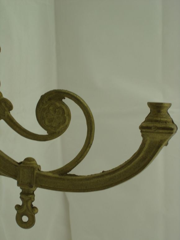 A large pair of gas light sconces in brass. Intricate scroll work. Would be lovely wired with huricane shades.
