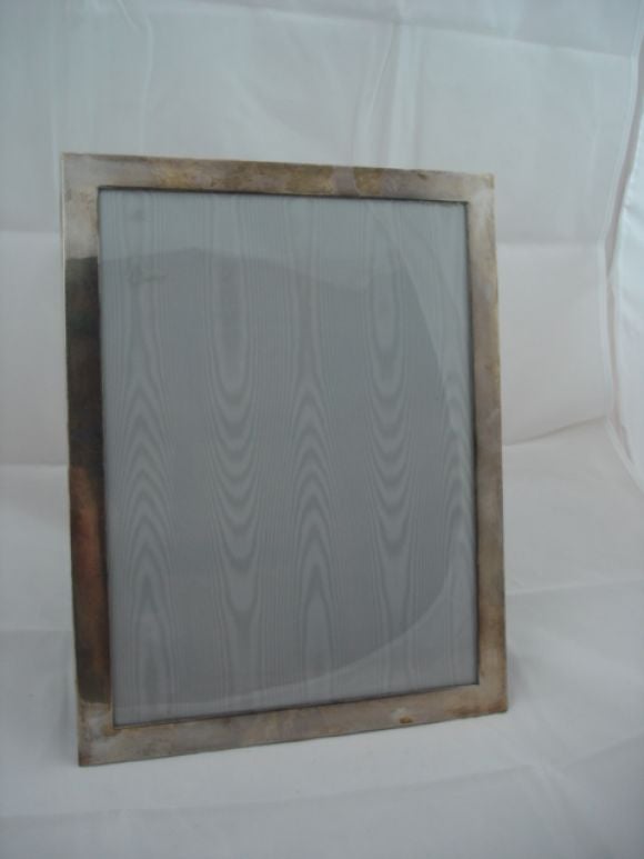 A fine and large sterling silver picture frame with the Tiffany Hallmark on the reverse.