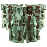 Retro A single sconce with carved and decorated glass.