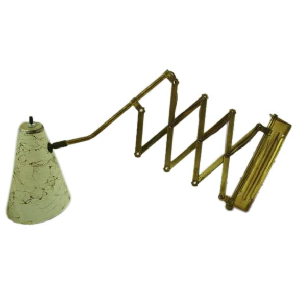 An extension arm reading light. at 1stdibs