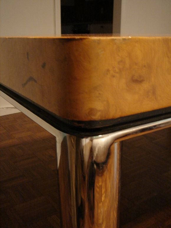 A fine Burlwood Dining table attributed to Milo Baughman