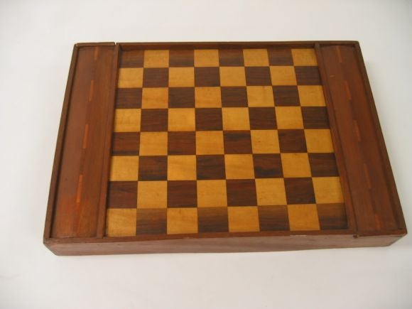 A fine wooden chess set with unusual chess pieces.