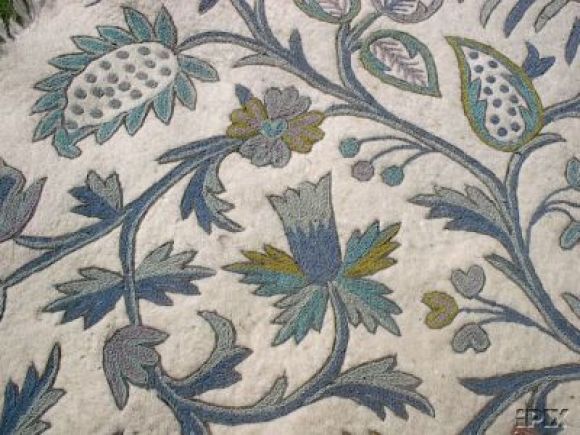 Stunning antique crewelwork woven panel with delicate coloring of the flowers on a felted wool base in blue and white and turquoise.Would make a great wall decoration, bedspread, or  for use in upholstery.