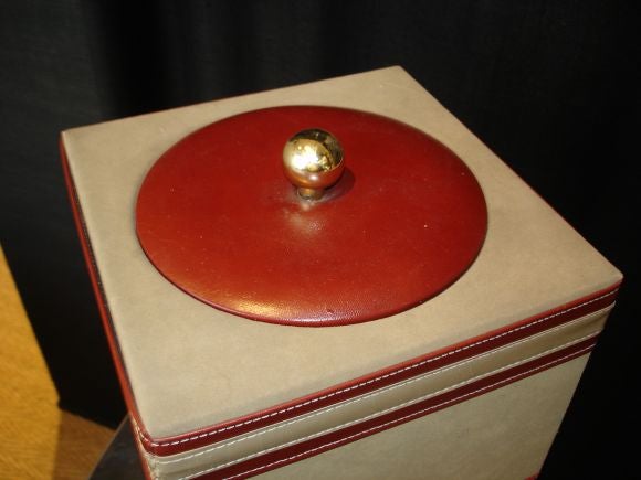 A faux suede and leather ice bucket.