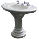 A Vintage Porcelain Pedestal Sink with Original Taps