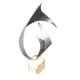 Steel Sculpture on a marble stand by C. Jere