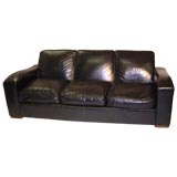 An Art Deco style black leather sofa