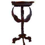 Antique An unusual hand carved table stand with winged phoenix support