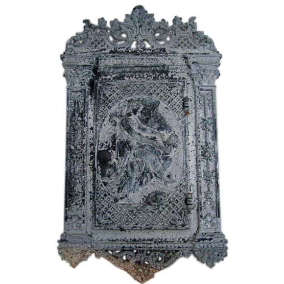 A Cast iron wall cabinet or mailbox