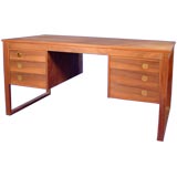 A unique rosewood bookcase desk with inset brass push pulls