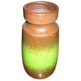 A slip glaze vase in green and brown.