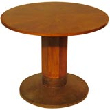 A Secessionist pedestal table with a hammered brass foot.