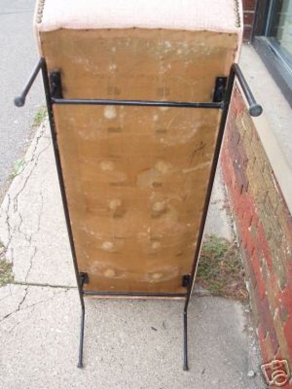 Wrought iron base supports tufted bench. Perfect as a bed bench. Original vinyl.