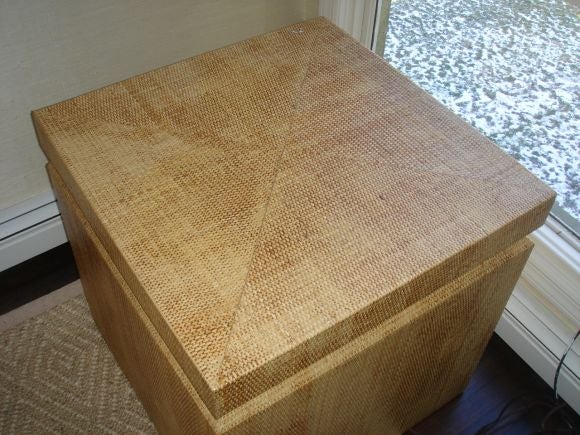 A large side table or pedestal covered in thick grasscloth and lacquered. Fine bevel creates the top portion.