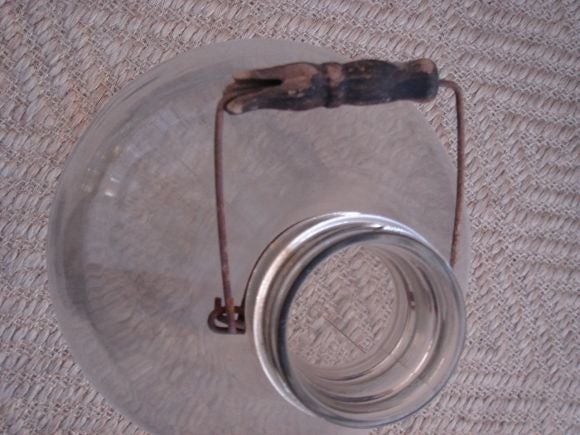 A Large Handblown Bottle with handle
