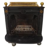A Cast Iron  Fireplace with Unique Brass Finials and Gallery