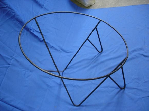 A pair or black painted iron frames with a characteristic 1950s shaped foot. Requires making a fabric sling to attach to the ring for seating.