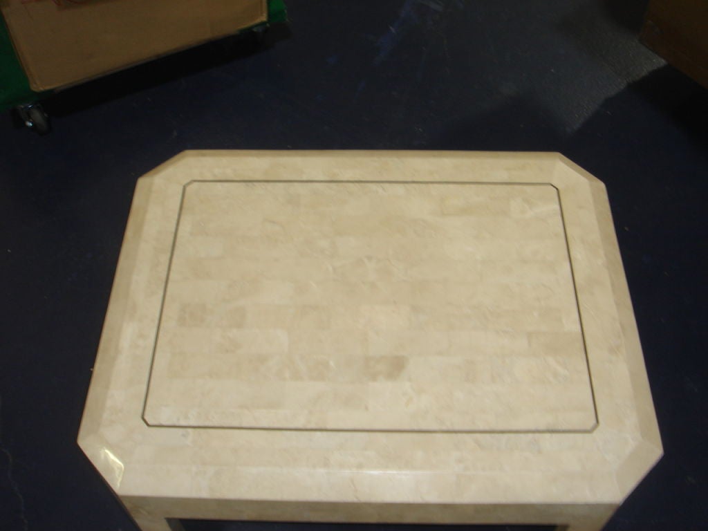A table of stone tiles with brass string inlay on top and legs. Style of Maitland Smith, unmarked.