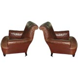 A PAIR OF WORN LEATHER CLASSIC CLUB CHAIRS