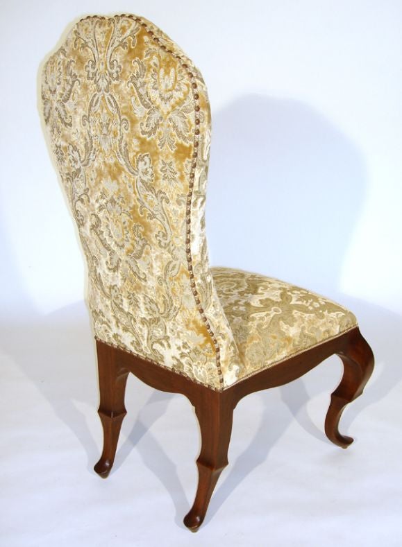 The hourglass upholstered high-back with a pinched crest is fully upholstered high-back with a pinched crest is fully upholstered and finished with tape trim for self welt and creates a pleasant silhousette with a generous comfortably upholstered