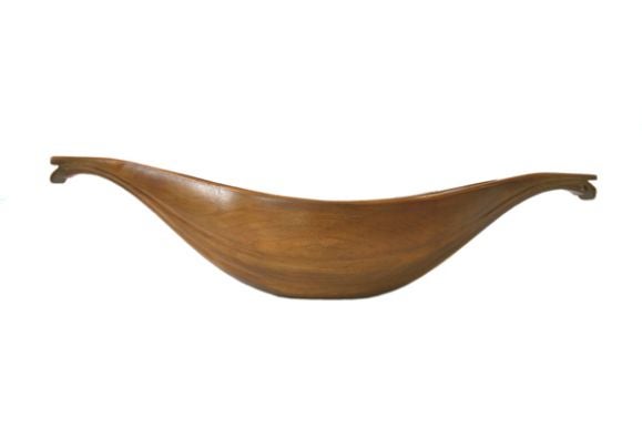 This classic shape with the wave form sides and squared of ends forms a graceful shape for a canoe that can go in either direction and to anchor or tie off with end spurs.  Copper liner available.  Also available in other woods and sizes.