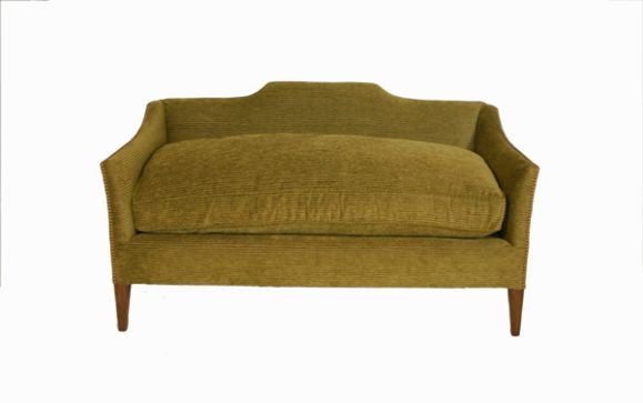 The low slung humpback crest rail fully enveloped an oversize down cushion. Cushion wrapped on 8 coil-sprung deck and supported by a sprung back. This sofa is for small spaces, in that it has a tight back and full depth seat in less than 34