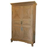 A LOUIS XIII STYLE DIAMOND POINT ARMOIRE WITH POCKET DOORS