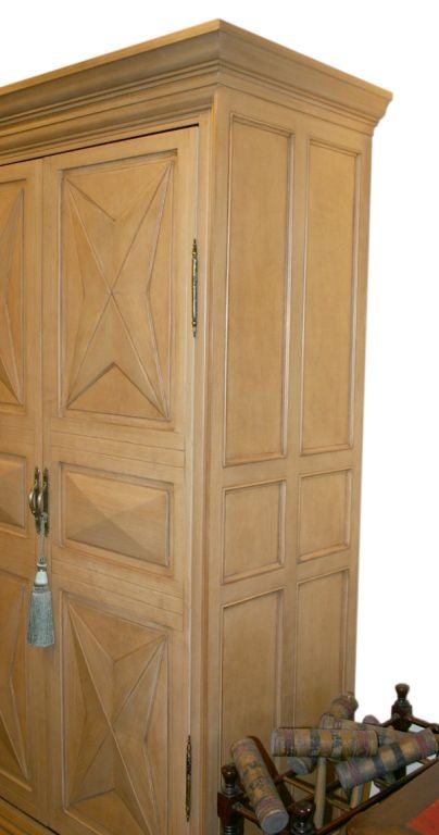A LOUIS XIII STYLE DIAMOND POINT ARMOIRE WITH POCKET DOORS