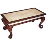 A ROBUST CELTIC BROOCH-FOOT COFFEE TABLE WITH  FAUX IVORY