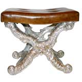 AN EN ARBALETTE GILT  BENCH WITH TUFTED LEATHER UPHOLSTERED SEAT