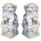 A PAIR OF CHINESE CAST STONE FU DOG GARDEN ORNAMENTS