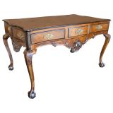 Used An eccentric Portugese rococo parcel ebonized library table