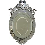 An Elliptical Venetian Style Mirror