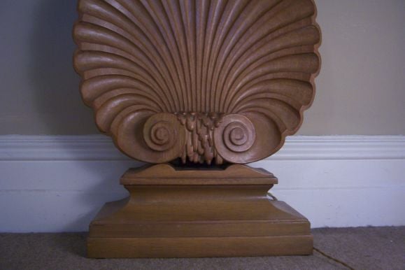 Beautifully simple and clean lines. The carved Venus shell sits at the base of this fantastic console table. Retains original Dunbar label on the back.