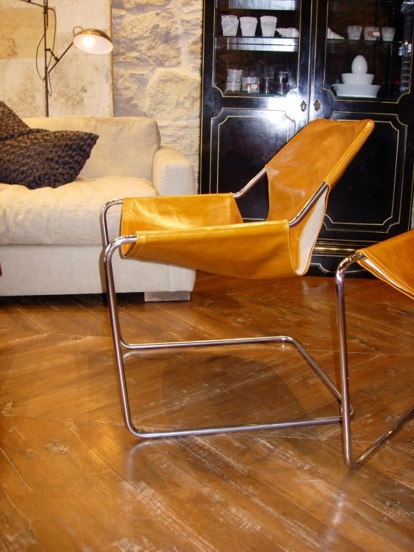 continuous steel frame with leather slip on seat designed in 1957 by Paulo Mendes, celebrated architect.  New production - freakishly comfortable.  slips available in black, cognac, white and bourdeaux.  price is per individual chair.