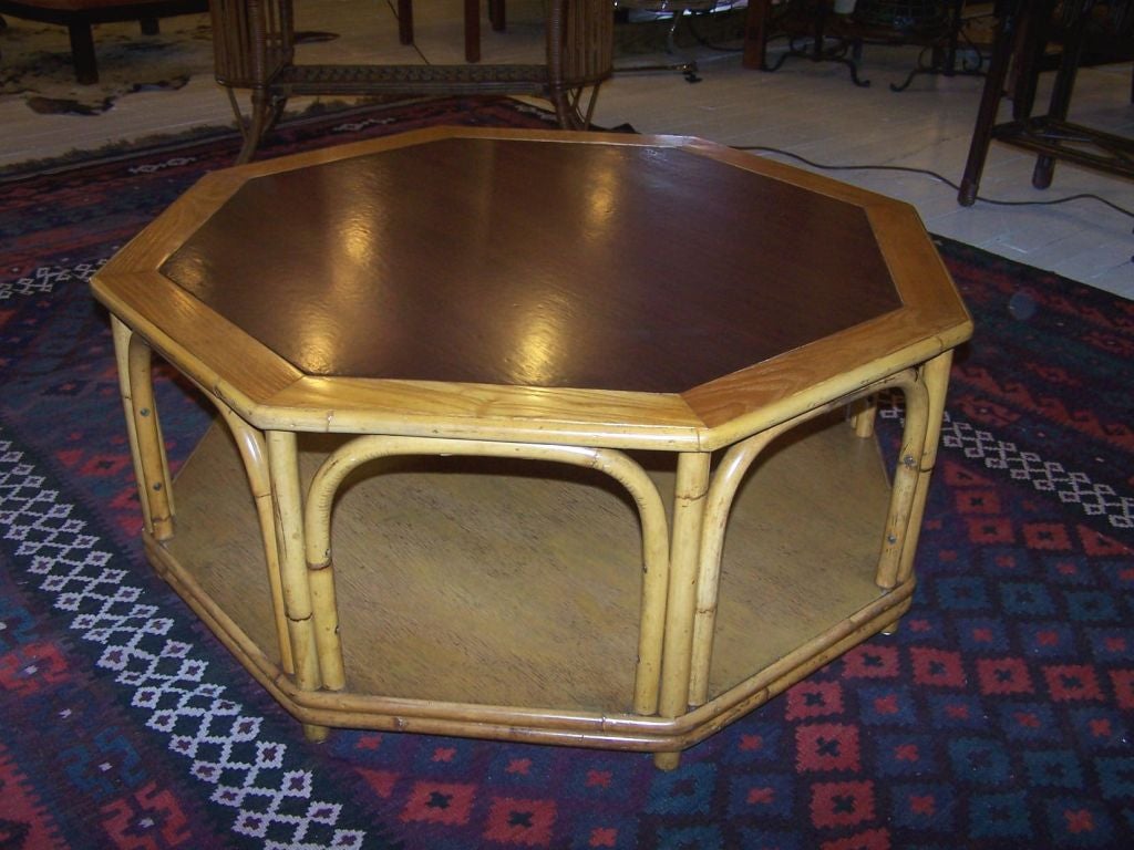Fine & rare octagonal rattan cocktail table with lower shelf.***Contact/Shipping Information: AOL (American Online) users may experience difficulties sending emails to us or receiving emails from us. If you have made an inquiry to us and have not
