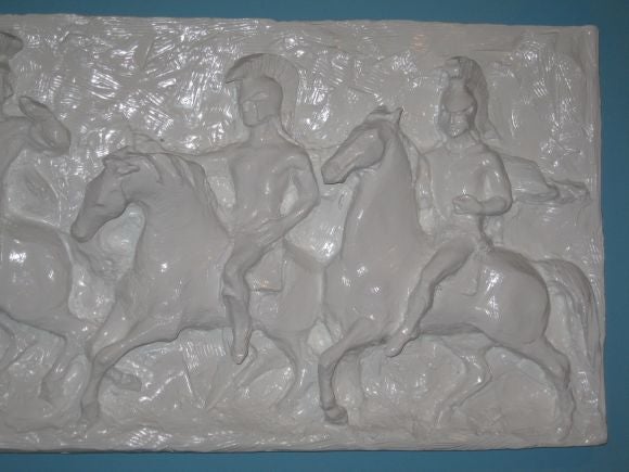 Signed by artist J. Segura and dated 1967 this wall relief depicts roman gladiators on horseback, and is finely detailed.  Recent heavy semi-gloss white painted finish. 24 HOUR HOLD ONLY.