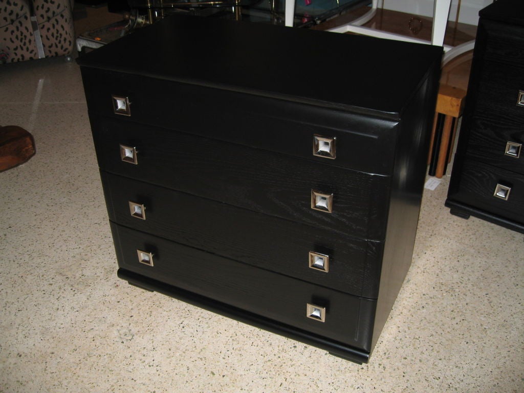 Late 40's chest of drawers by the Mengel Furniture Company. Done in a raised grain ebonized oak with natural ash drawer interiors. Square nickel drawer pulls. 24 HOUR HOLD ONLY