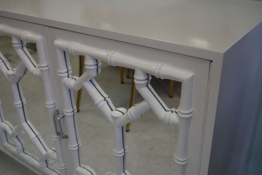 FAUX BAMBOO AND MIRRORED FLOATING CABINET