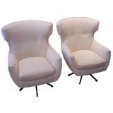 A Pair of Modern Wingback Swivel Armchairs
