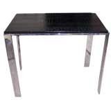 A Faux Alligator Leather Top and Heavy Polished Steel Table