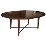 A Oval Mahogany Cocktail Table by Andre Arbus