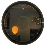 A Round Wall Mirror in a Chrome Frame