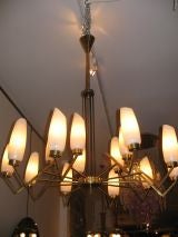 A Pair of Large Brass and Black Metal Chandeliers by Stilnovo