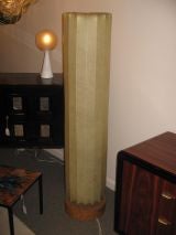 A Cellulose Ribbed Column Lamp on a Cork Base