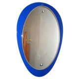 A Stylized Oval Wall Mirror by Fontana Arte